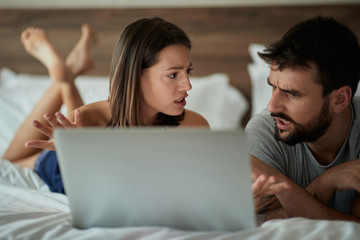 Fototapeta premium discussion couple in the bed Modern lifestyle concept..