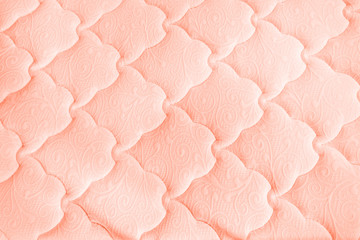 Living coral background from textile. Texture. Top view.