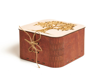 box with wooden lacing, with a tree on the lid, on a white background