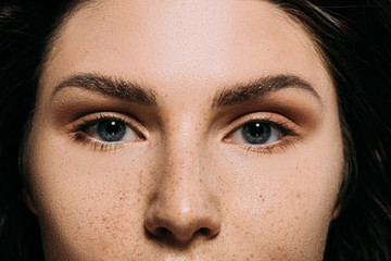 close up of attractive girl with freckles on face