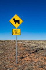 An animal warning sign on a road, in rural New Mexico
