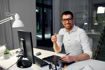 business, graphic design and technology concept - smiling businessman or designer with computer and...