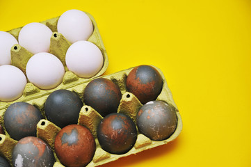 Chicken eggs on yellow background. 