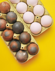 Chicken eggs on yellow background. 