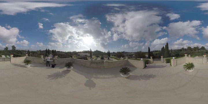 360 VR video. Scenic view of Bahai Gardens terrace in Haifa, Israel. Man tourist shooting manmade beauty included in World Heritage List