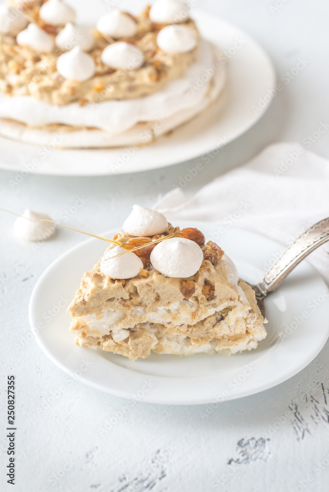 Sticker pavlova cake with caramel and almonds