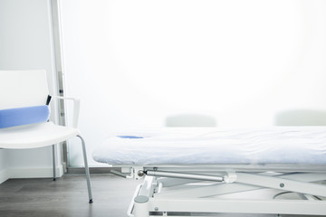 Room of a physiotherapy center with a massage table
