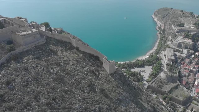 Panning from left to right and clockwise from the side of the Palamidi Castle in Nafplio Greece. Showing the sea in the background and part of the city in the end. Sunny day. Flat profile but also ava