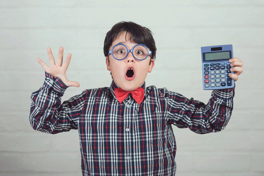 surprised student showing a calculator