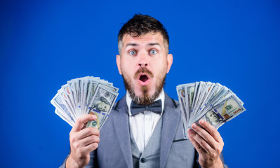 The result surpassed all his hopes. Bearded man holding cash money. Rich businessman with us dollars banknotes. Currency broker with bundle of money. Making money with business. Business startup loan