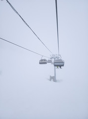 Snow is like fog. Mountain lift