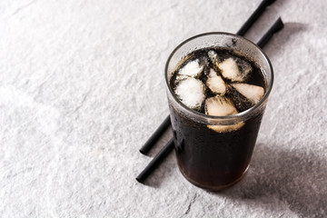 Soft drink cola glass for summer  on gray background. Copyspace
