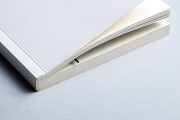 Single white book or notebook with pen for notes