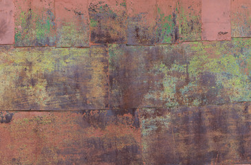 Wall of rusty iron sheets.