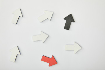 top view of red, black and white pointers on grey background