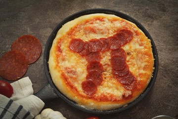 Pi day pepperoni Pizza overhead view