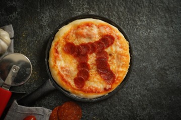 Pi day pepperoni Pizza overhead view - obrazy, fototapety, plakaty