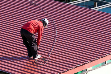 Workers repair the roof.