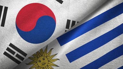 South Korea and Uruguay two flags textile cloth, fabric texture