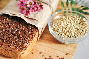 Useful home-made vegan sourdough bread from green buckwheat with flax and sunflower seeds. Raw healthy and proper nutrition