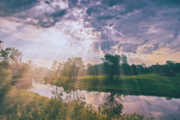 sun rays breaking through storm clouds