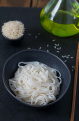 Rice noodles in a black bowl