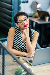 Attractive young woman looking straight at camera