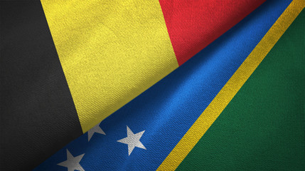 Belgium and Solomon Islands two flags textile cloth, fabric texture