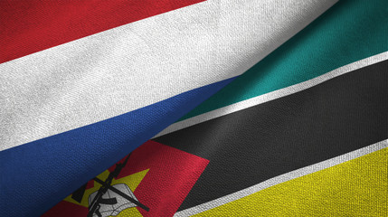 Netherlands and Mozambique two flags textile cloth, fabric texture