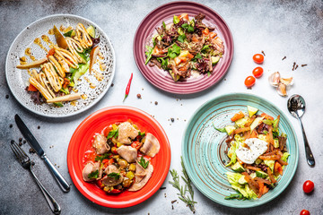 Fish and meat meals variety flat lay. Top view on buffet with assortment of healthy hearty food. Buffet, banquet, appetizer, restaurant menu concept