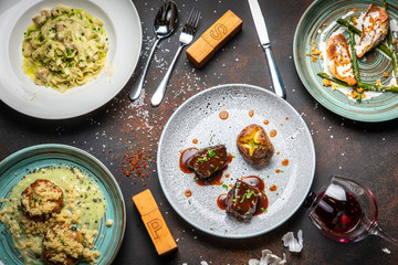 Fish and meat meals variety flat lay. Top view on buffet with assortment of healthy hearty food. Buffet, banquet, appetizer, restaurant menu concept