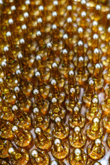 Production line manufacture of ampoules with drugs. A large number of containers with the drug on the conveyor of the pharmaceutical plant.