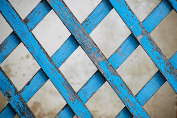 Retro wall and blue wooden fence. Closing on blue wooden panels of the fence. Wooden texture.