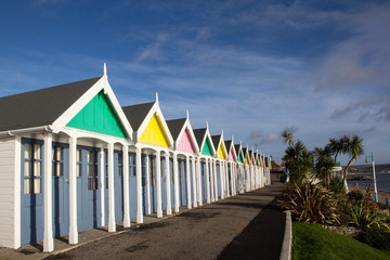 A row of beach huts at Weymouth, a town in Dorset on the south coast of England, UK..