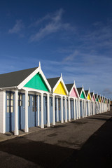 A row of beach huts at Weymouth, a town in Dorset on the south coast of England, UK..