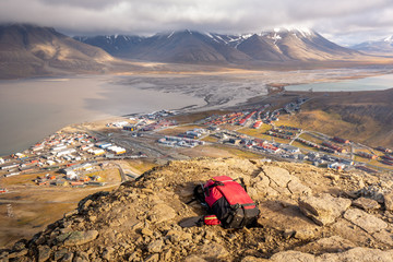 Backpack hiking. View over Longyearbyen from above - the most Northern settlement in the world....