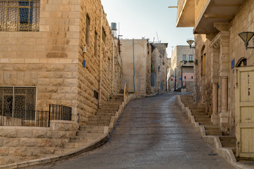 Empty narrow street in historical old town Bethlehem, Palestine. Copy space.