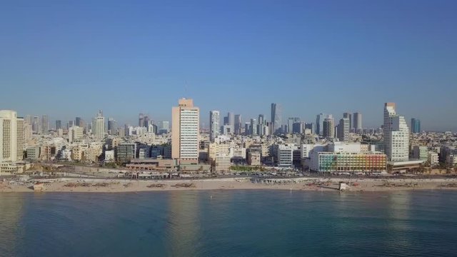 Tel aviv, Israel - Aerial footage of the city's skyline and crowded beach on a summer's day