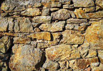 Characteristic stone wall typical of country houses in Mykonos island