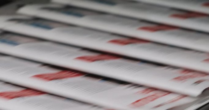 Newspapers, tabloids, print plant factory,magazine transports on conveyor belt line after printing units