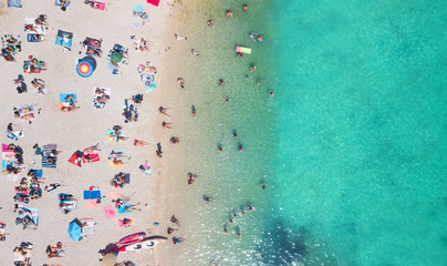 Fototapeta na wymiar Beach and waves from top view. Turquoise water background from top view. Summer seascape from air. Top view from drone. Travel-image