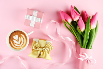 Fresh flower composition, bouquet of bi color tulips, pale pink and white gradient background. International Women's day, mother's day greeting concept. Copy space, close up, top view, flat lay.