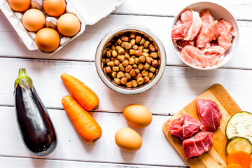 ingredients for pet food holistic top view on wooden background