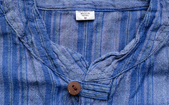 Vintage blue flannel shirt neck with wooden button with a button loop