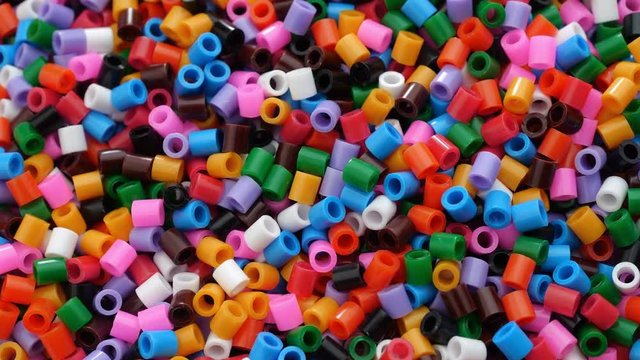 Colorful fusible plastic beads. Close up.