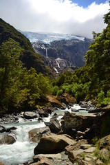 Glacier waterfalls falling into valley