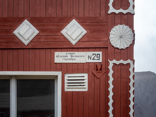 Pyramiden. Abandoned Soviet/Russian settlement in Svalbard, Norway. Street sign at the old wooden,...