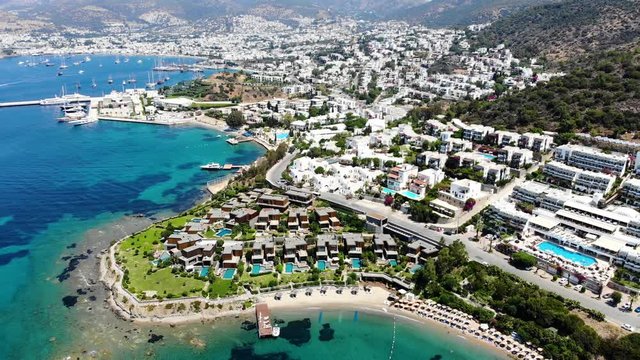 Aerial view of sunny Bodrum with resorts and beachfront villas, Turkey