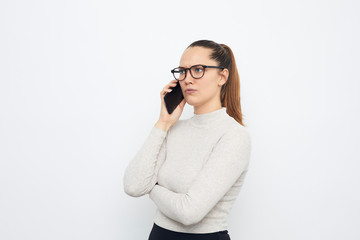 serious business woman talking on the phone