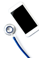 diagnostic of gadgets on white background with stethoscope top view